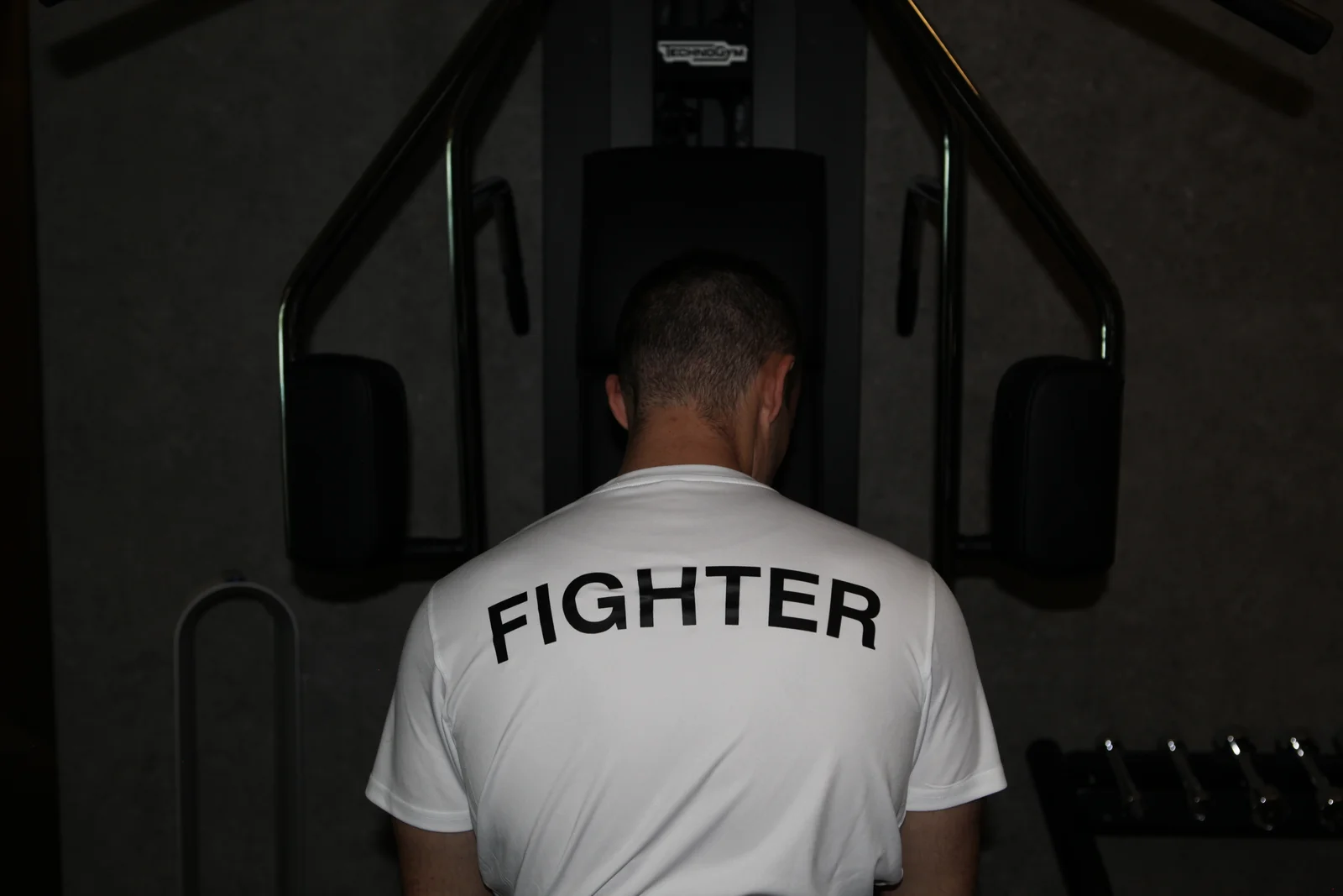 Fighter's wrapped hands on heavy bag